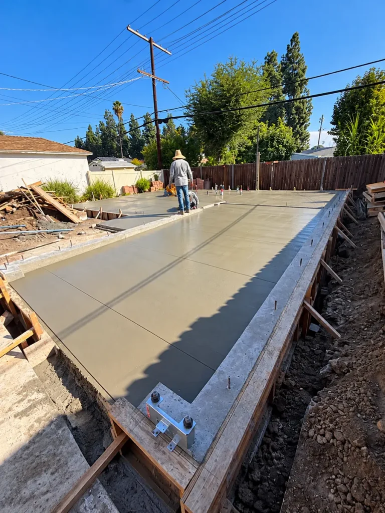 Freshly poured slab with anchor bolts for the Encino ADU