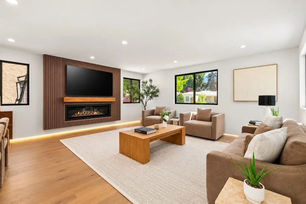 Living room in a MAMOS remodel in Rancho Park, wood slat wall with a linear fireplace