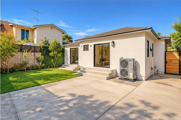 Home addition in Long Beach built by MAMOS, stucco walls, sliding glass doors and new steps to the yard