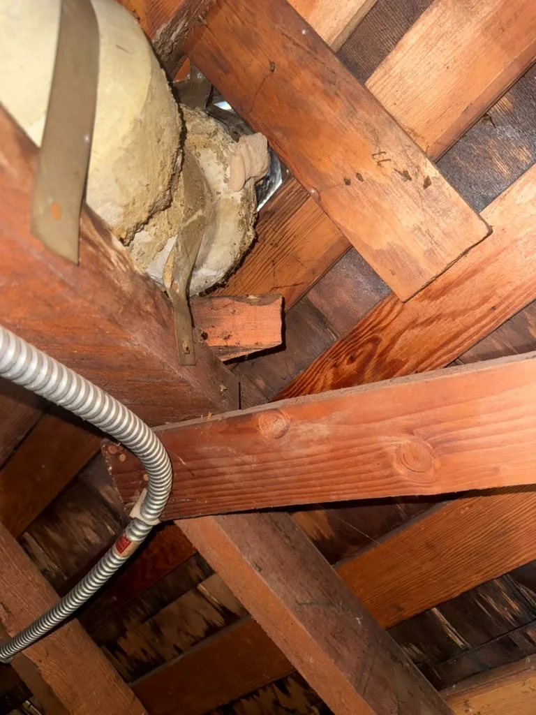 Attic: open gap around a pipe penetration